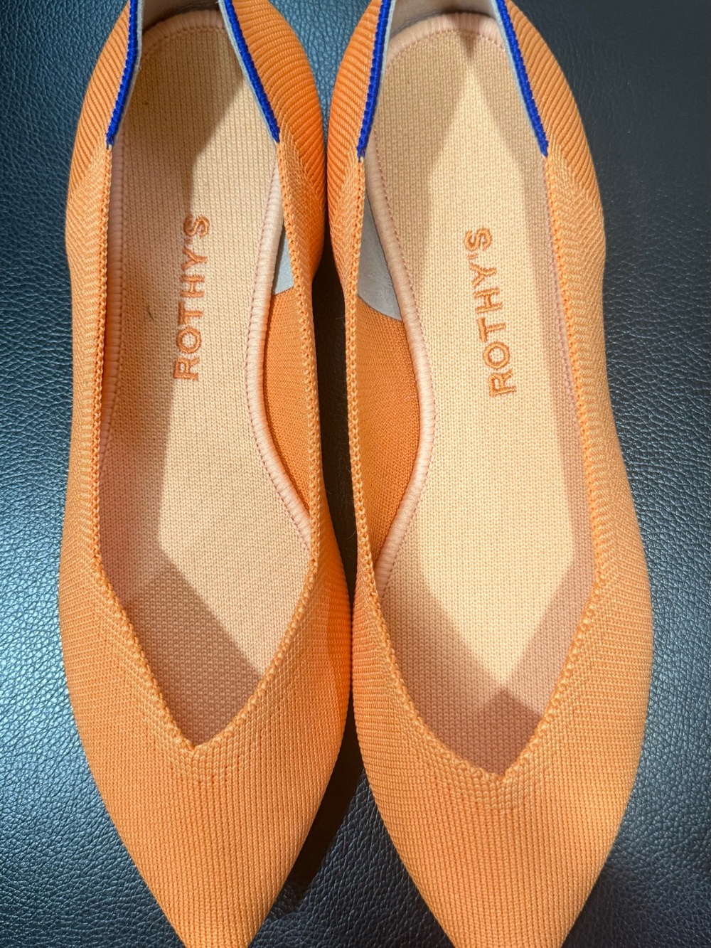 Rothy's Pointed Knit Flats in Bright Orange with Blue Trim
